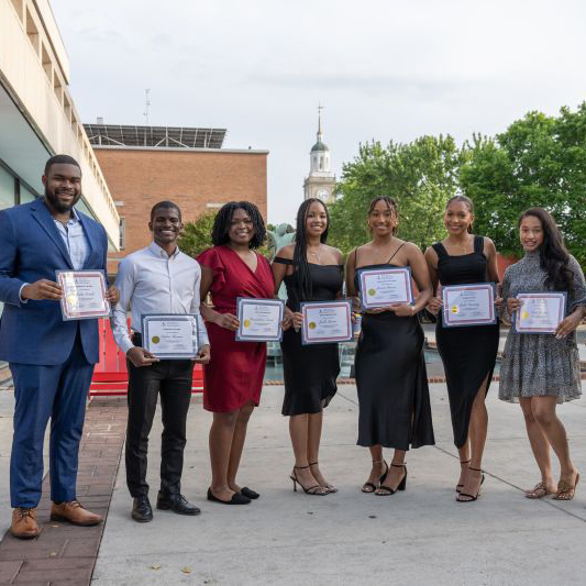 Howard Students holding certificates